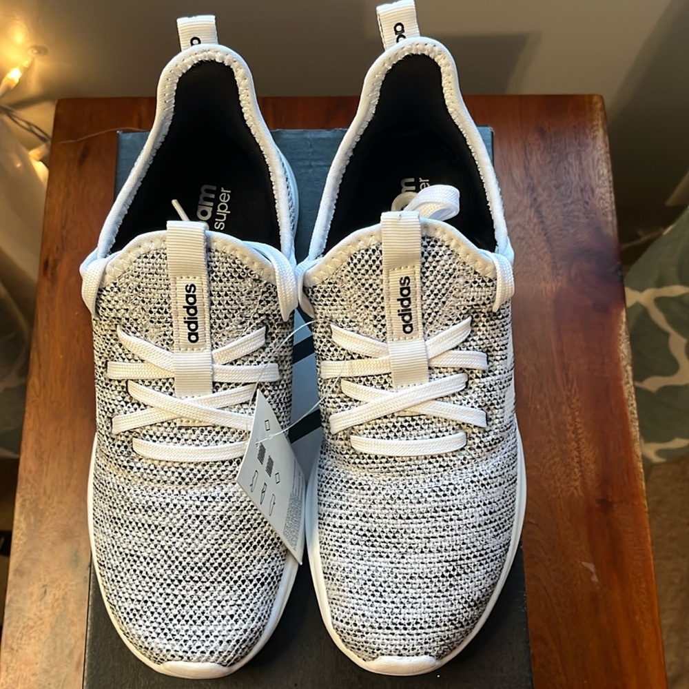 NWT. Women’s Adidas Puremotion Adapt running shoes size 6 in black/white.